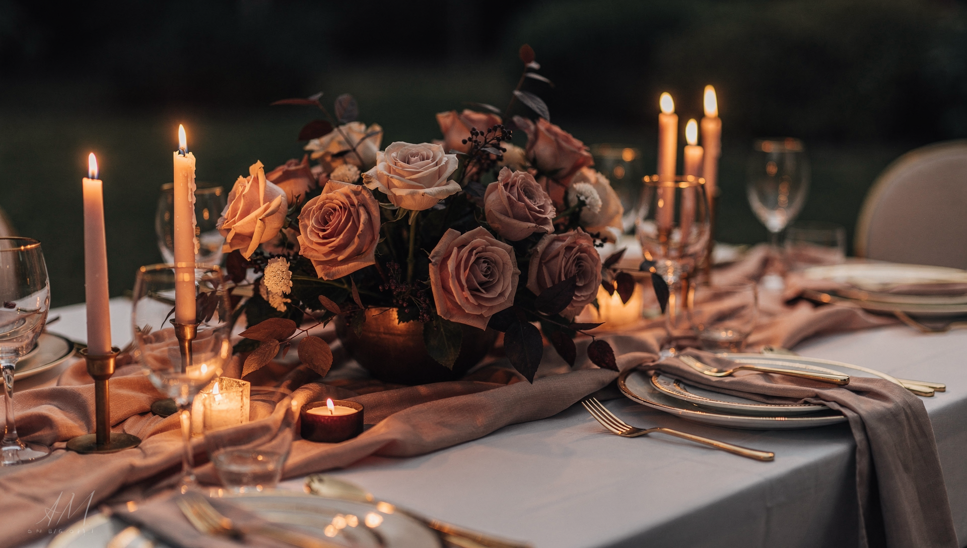 Petale Floral — a long-table reception styled with trailing candles, cascading floral garlands, and linen napkins in a Bangsar garden venue