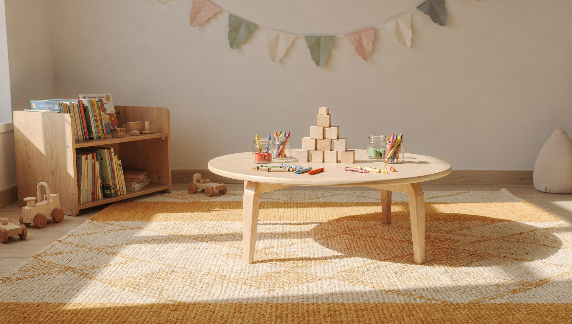 Children at Marigold Montessori — reading corner and art table in the warm classroom